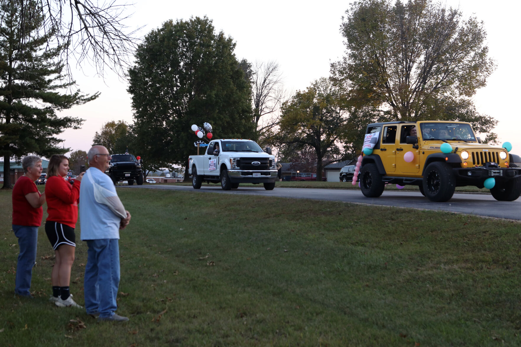 People watch the beginning of the St. Clair homecoming parade